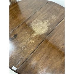 George III mahogany drop leaf table, the oval top raised on turned swing legs with pad feet W108cm
