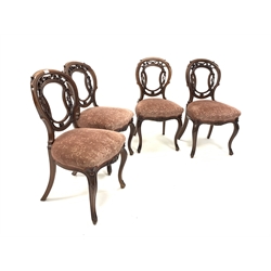 Set of four Victorian mahogany side chairs, with floral and scroll carved open back over upholstered seats, raised on slender cabriole supports, W45cm