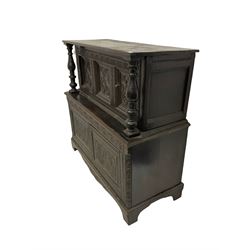 19th century and later oak court cupboard, the rectangular top over two cupboard doors flanked by two turned pillars over two large cupboards  profusely carved with lunettes and foliate design W135cm, H129cm, D57cm 