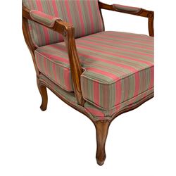 French style armchair, upholstered in stripe fabric, raised on cabriole supports 