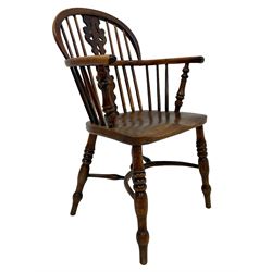 19th century yew wood and elm Windsor chair, low hoop stick back with pierced ad figured splat, dished seat raised on ring turned supports joined by crinoline stretcher