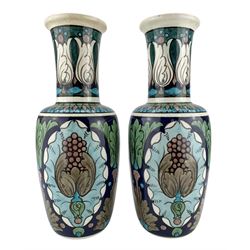 Pair of Burmantofts Faience Anglo-Persian vases, designed by Leonard King, of shouldered form, painted with stylized flowers and foliage against a blue ground, impressed factory marks, model no. 167, incised D.601, 2851 & 2851 and artists monogram LK, H30cm