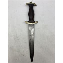 Replica German Third Reich SS dagger the blade engraved 'Meine Ehre heist Treue' and with RZM code for 1934, black wooden grip with silvered eagle and enamelled circular SS Sigrunen, with nickel mounted scabbard.
We understand that this was brought back from Germany by the vendor's father circa 1945