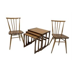 G-Plan - Teak nest of three tables, (W54cm) together with a pair of elm and beech spindle back dining chairs, with shaped seats, raised on turned tapered supports (W39cm)