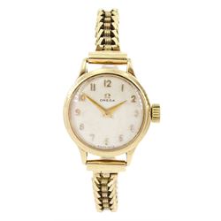 Omega ladies 9ct gold manual wind wristwatch, silvered dial with Arabic numerals, Birmingham 1957, on 9ct gold bracelet, with fold-over clasp, Birmingham 1962