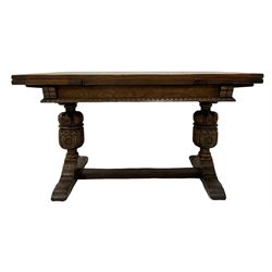 20th century oak drawer-leaf dining table, raised on carved baluster supports, united by a stretcher 