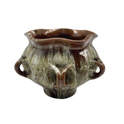 Linthorpe pottery ring handled jardinere shape No.179 designed by Christopher Dresser with green and white striations on a brown ground D15cm x H14cm 