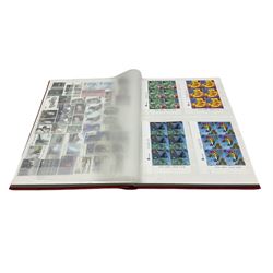 Queen Elizabeth II mint decimal stamps, housed in a stockbook, face value of usable postage approximately 210 GBP