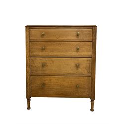 Early 20th century oak straight-front chest, fitted with four graduating drawers with octagonal brass handles, raised on turned supports with pad feet
