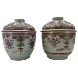 Pair of 19th century Chinese famille rose bowls and covers, the domed covers and bowls  painted with peonies, within pink and green lappet shaped borders, H24cm x D19.5cm. Provenance: From the Estate of the late Dowager Lady St Oswald