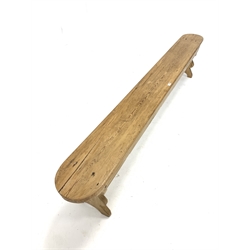20th century pine bench raised on shaped panel end supports 