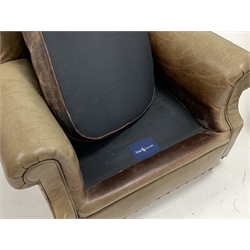  Ralph Lauren for Harrods - Large pair of armchairs, upholstered in deep buttoned green tan leather, with loose cushion, raised on compressed bun feet, W95cm, H93cm, D100cm  