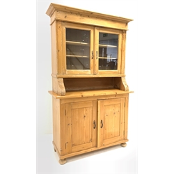 20th century pine country kitchen dresser, projecting cornice over double glazed doors enclosing two shelves, two cupboards under enclosing shelves