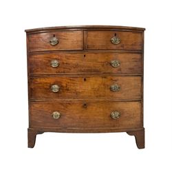 George III mahogany bow-front chest, fitted with two short over three graduating drawers, each cockbeaded with pressed brass plates and drop handles, raised on bracket feet