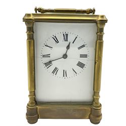 French timepiece carriage clock c1900 with a cylinder platform escapement, white enamel dial, Roman numerals and minute track, steel spade hands with three bevelled glass panels and a rectangular glass panel to the top of the case. With key.