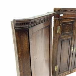 Georgian oak wall hanging corner cupboard, with dentil cornice over two panelled doors, (W79cm) and another similar Georgian corner cupboard, (W72cm)