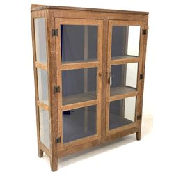 Peter 'Rabbitman' Heap of Wetwang - Yorkshire oak cabinet, glazed doors and sides enclosing lined back and two shelves, stile supports featuring rabbit signature (W102cm, H127cm, D30cm)
