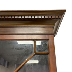 George III mahogany bureau bookcase, projecting dentil cornice over two astragal glazed doors, the bureau with fall front enclosing fitted interior, four graduating long cock-beaded drawers below, on bracket feet