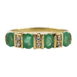 9ct gold four stone oval emerald and six stone diamond ring, hallmarked