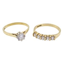 Gold single stone cubic zirconia ring and one other five stone cubic zirconia ring, both hallmarked 9ct