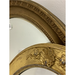 A gilt and gesso oval wall mirror with shell motif and bevelled plate (50cm x 78cm) and another with egg and dart moulding, (60cm x 84cm)
