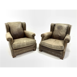  Ralph Lauren for Harrods - Pair of deep wingback club armchairs upholstered in studded green tan leather, raised on block supports, W88cm, H80cm, D111cm  