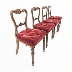 Set four early Victorian rosewood dining chairs, shaped crest rail and bar back all floral and scroll carved, seat upholstered in buttoned velvet, raised on turned and fluted supports W50cm