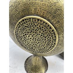 Indian engraved brass rosewater ewer decorated with foliage etc H58cm and an Indian mirror in a copper circular frame decorated with a raised pattern of animals D41cm