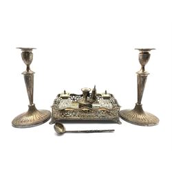 Victorian plated rectangular inkstand, with two glass inkwells and pierced gallery engraved with a crest, pair of 19th century plated candlesticks H28cm and small plated ladle