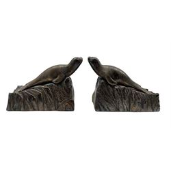 Pair of 1930's French silvered bronze bookends in the form of Seals with ruby glass eyes, one inscribed with the initial E, L13cm