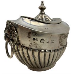 Late Victorian silver tea caddy of oval design with hinged lid, gilded interior, urn finial, half body reeded decoration and lion mask ring handles W10cm Birmingham 1898 Maker Thomas Hayes