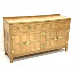 'Eagleman' adzed oak dresser, three drawers above two double cupboards enclosed by four panelled doors, brass fittings, by former 'Mouseman' apprentice Albert Jeffray of Sessay, Thirsk, W148cm, H86cm, D47cm