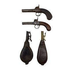 Early 19th century percussion pistol with engraved lock, another and two leather shot flasks