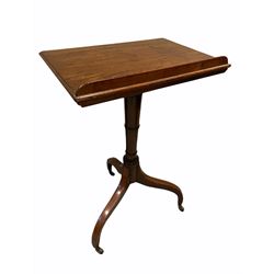 Early Victorian mahogany reading table, the angle adjustable moulded top over ring turned column and raised on three inverted splayed supports with castors 