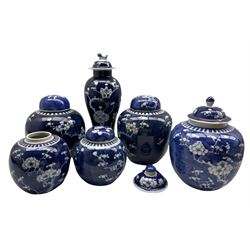 Group of Chinese Prunus pattern ceramics to include a matching pair of ginger jars, inverted baluster vase and cover, another pair of ginger jars and one other, H32cm max (6)