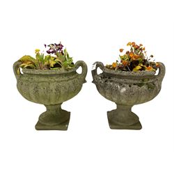 Pair of 19th century sandstone Campana type garden urn planters, on later composite stone plinths 