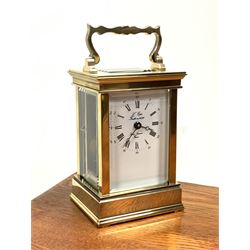 20th century brass carriage clock by 'l'epee, St Suzanne France' white enamel dial with Roman and Arabic chapter ring, with key, in associated leather case 