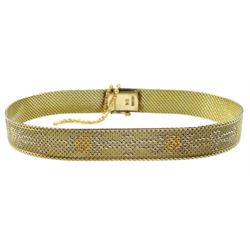 Early-mid 20th century yellow gold mesh bracelet, the centre with white and yellow gold floral decoration, stamped 9ct