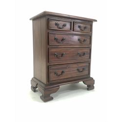 Ancient Mariner - miniature Georgian style mahogany chest, fitted with two short and three long drawers, raised on ogee bracket supports W