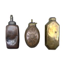 Two bottle shaped powder flasks in copper and brass and other powder flask of oval form, L17.5cm max (3)