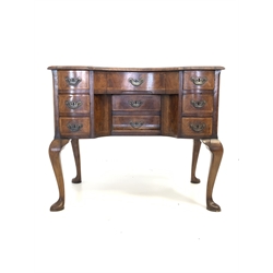 18th century walnut and oak serpentine lowboy, the cross banded, herringbone inlaid and moulded top over nine drawers, raised on cabriole supports W89cm, D52cm, H77cm