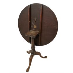 George III mahogany tripod table, circular tilt-top on turned baluster pedestal, three splayed supports with pad feet