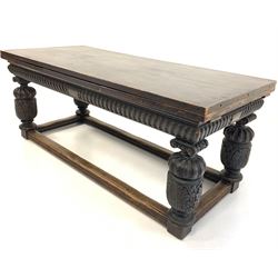 Late Victorian 18th century design oak draw leaf dining table, the rectangular top over gadroon moulded cushion frieze, raised on leaf carved baluster supports united by square moulded stretchers 191cm x 83cm, H77cm (Extended 321cm)
