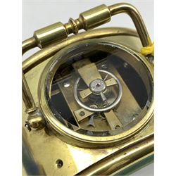 Brass cased drum type alarm clock, white enamel dial with Roman chapter ring inscribed Hyde and Sons Sleaford, (D10cm) together with a small mechanical alarm clock dial inscribed Swiza 