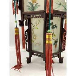 Chinese carved wood dragon palace lantern with rectangular frosted glass panels of bird and flower design and red fringe tassels h41cm