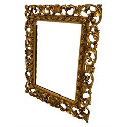 Italian gilt framed Florentine wall mirror, pierced and scrolling foliate decoration surrounding rectangular plate