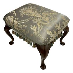 Georgian design mahogany footstool, the overstuffed seat upholstered in pale blue urn patterned fabric with fringe, raised on cabriole supports with inner c-scroll and pad feet 
Provenance: From the Estate of the late Dowager Lady St Oswald