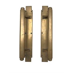 Pair of Art Deco bronze door handle pulls, having octagonal handles and geometric mounts, 36cm x 5.5cm