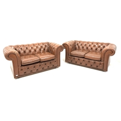  Pair of Brown leather two seat chesterfields, deep buttoned, raised on castors, W152cm  