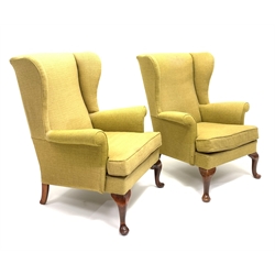 Pair Parker Knoll wingback armchairs, beech framed with cabriole supports, upholstered loose seat cushion, W77cm